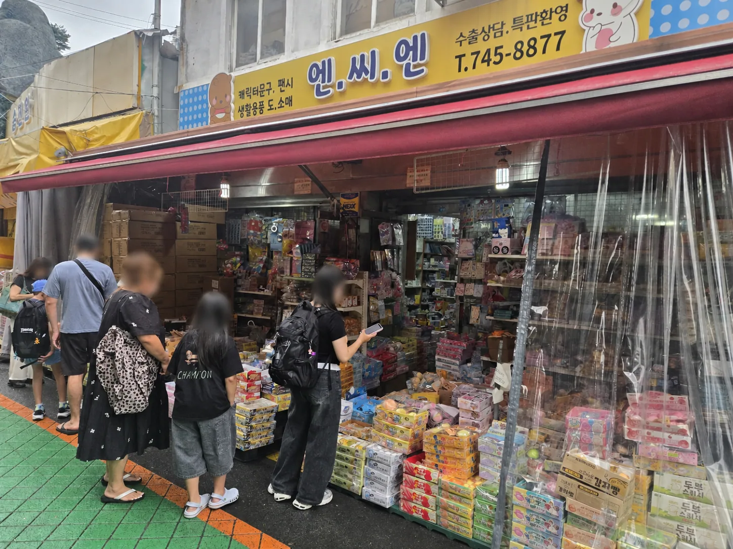 Stationery and small gift shop on Dongdaemun Toy & Stationery Street with products displayed outside