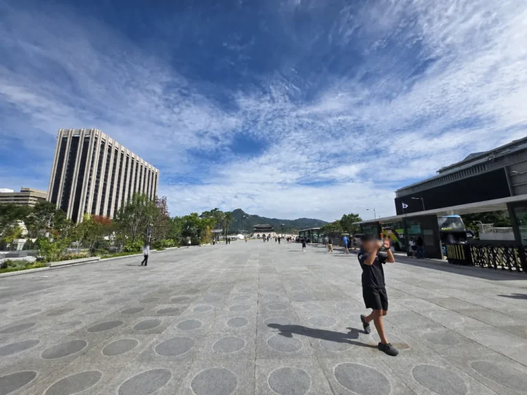 Wide pedestrian plaza leading toward Gwanghwamun Gate in Seoul