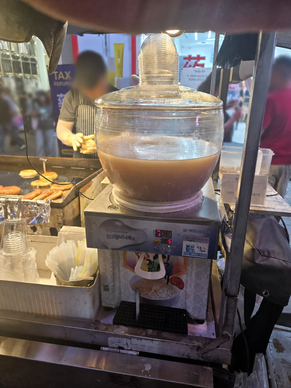 Glass dispenser of sweet Korean rice drink sikhye in Myeongdong