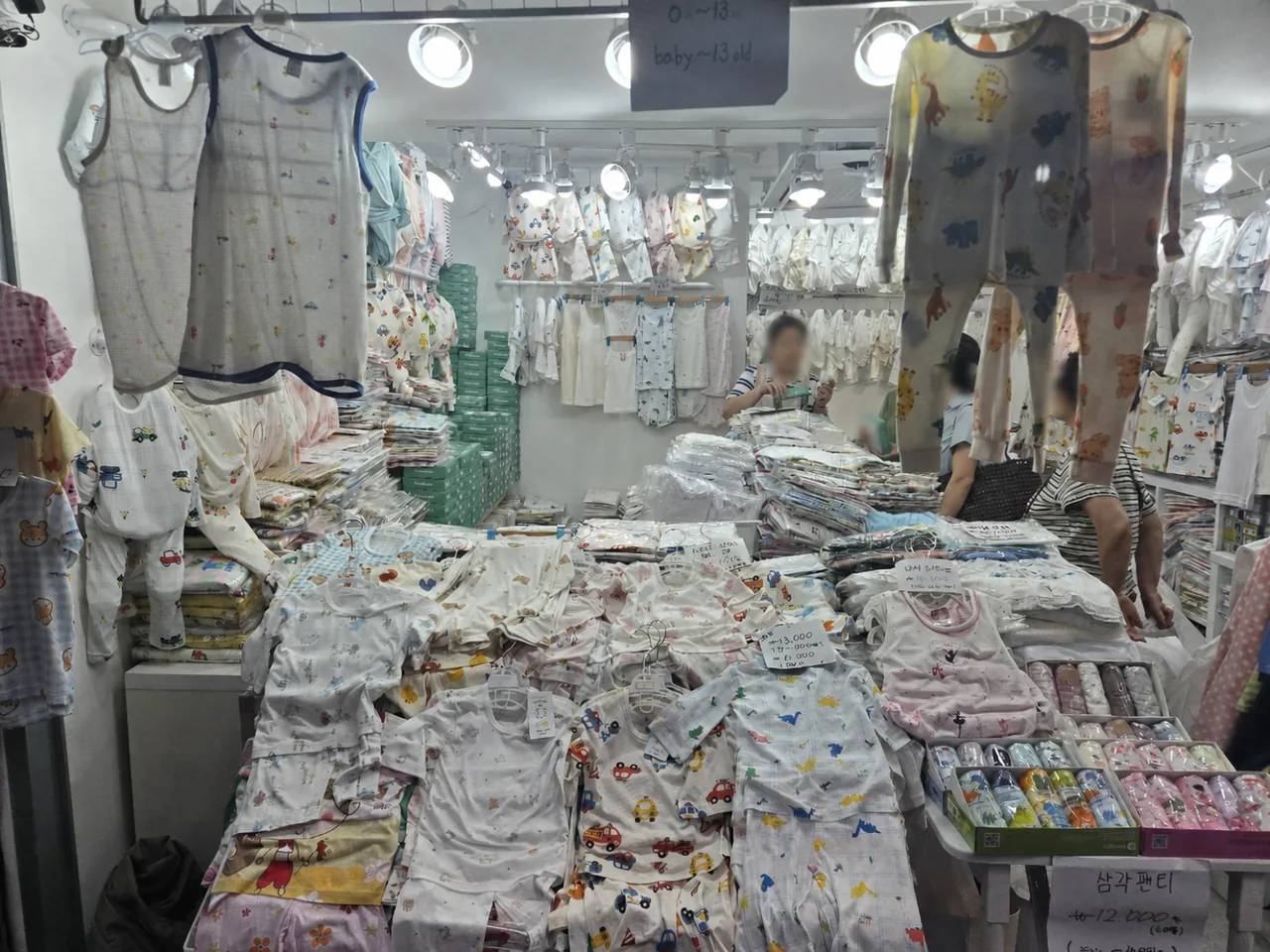 Baby clothes and sleepwear displayed inside Namdaemun children’s clothing market