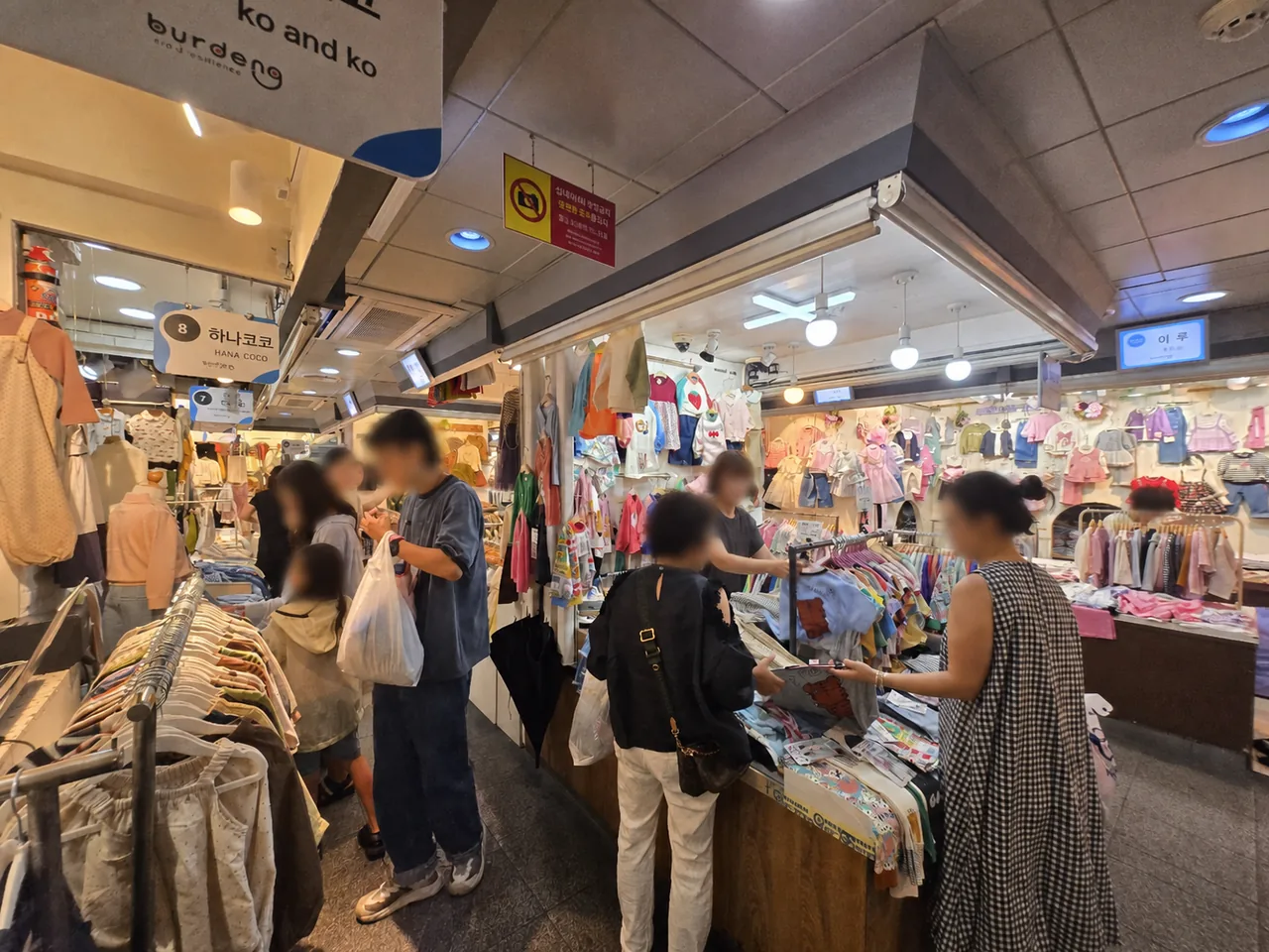 Families shopping inside Namdaemun children’s clothing market