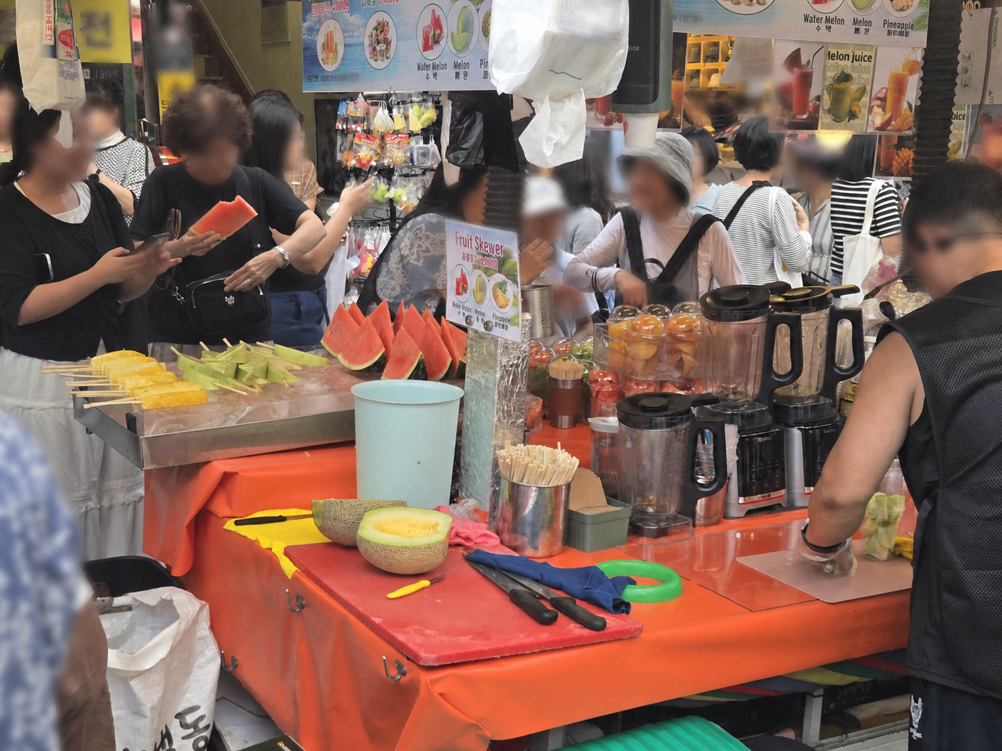 Fresh watermelon and melon fruit skewers at a Namdaemun Market stall