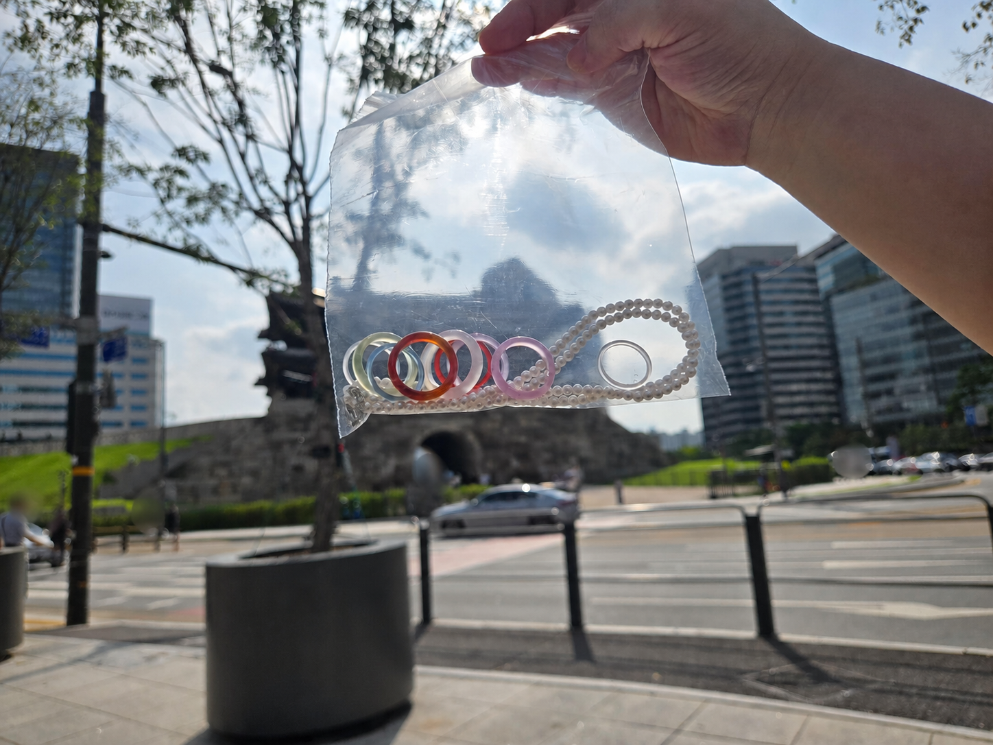 Namdaemun jewelry rings and pearl necklace with Sungnyemun Gate in the background