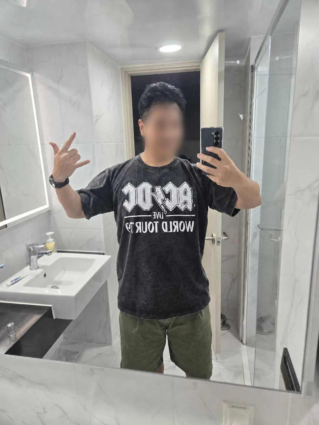 Uncle Choi wearing one of two AC/DC T-shirts bought at Dongmyo Flea Market