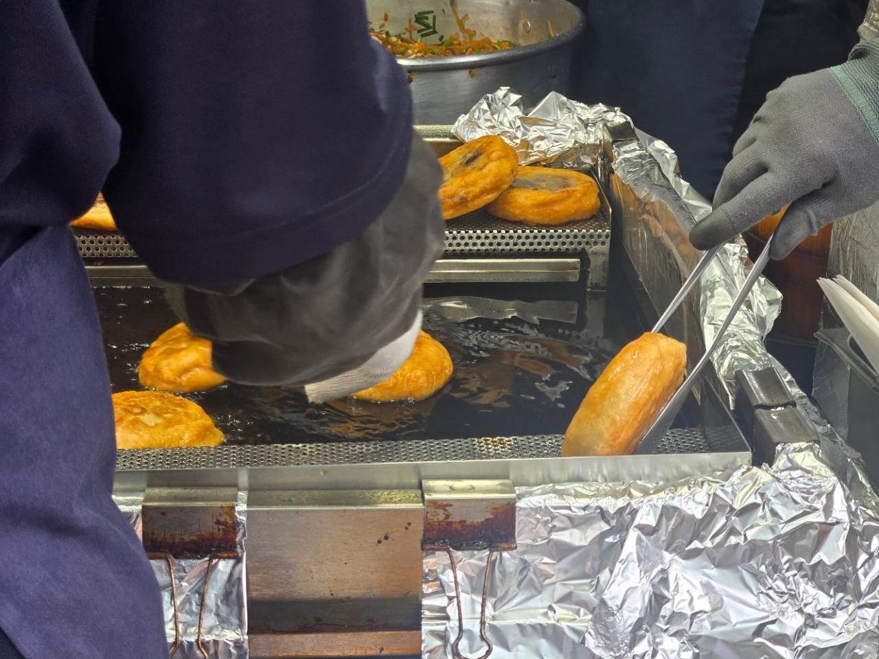 Namdaemun vegetable hotteok cooking on a hot griddle