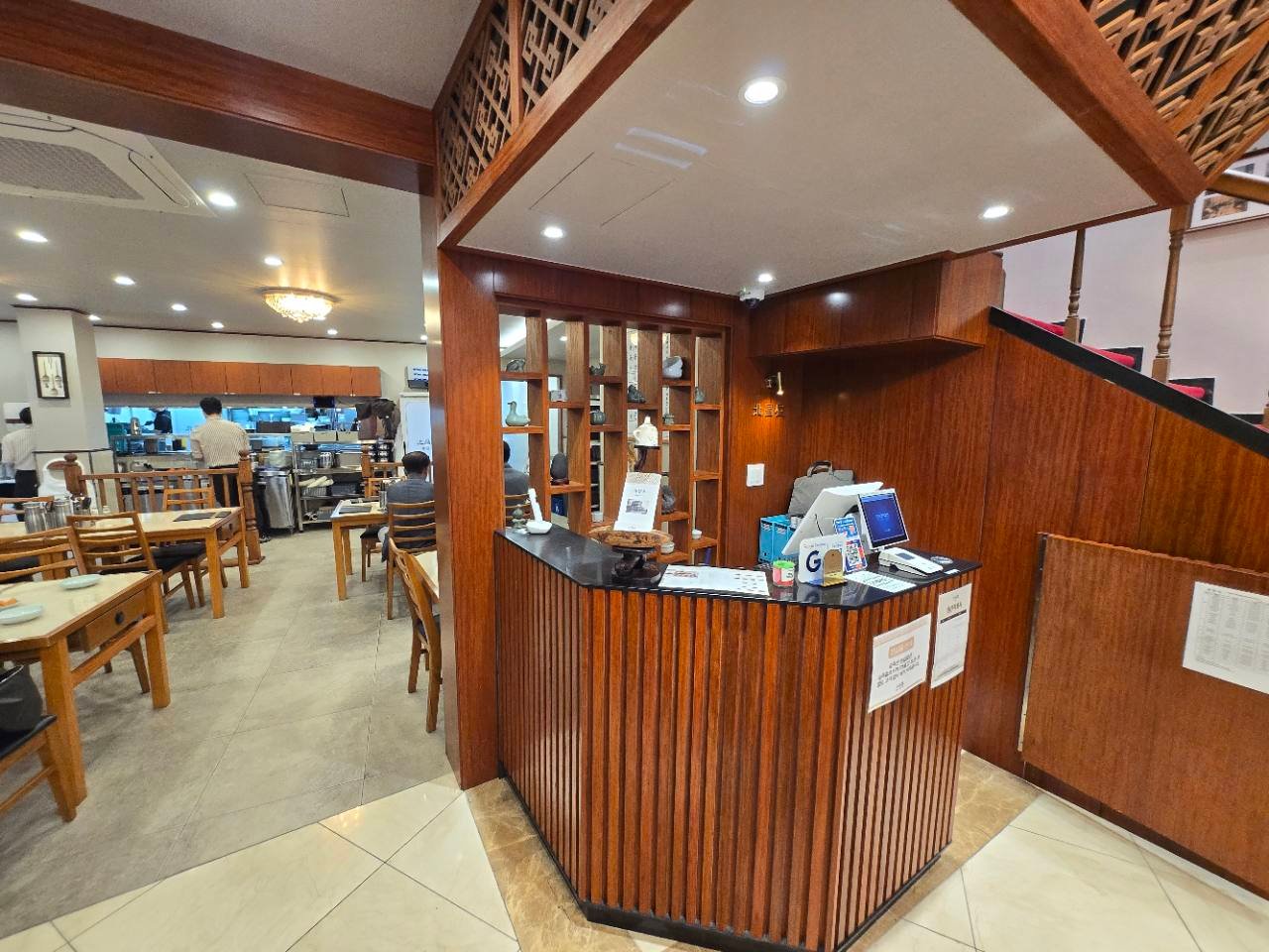 Clean wood-accented interior at Bukchangok in Seoul