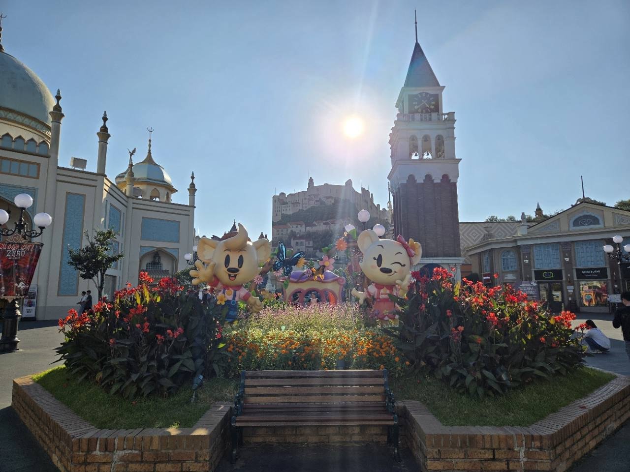 Everland Korea daytime entrance with flowers and character figures