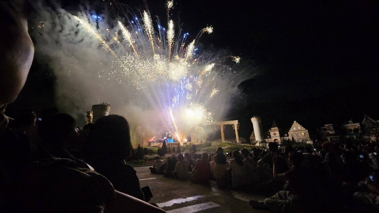 Fireworks lighting the sky above Everland at night