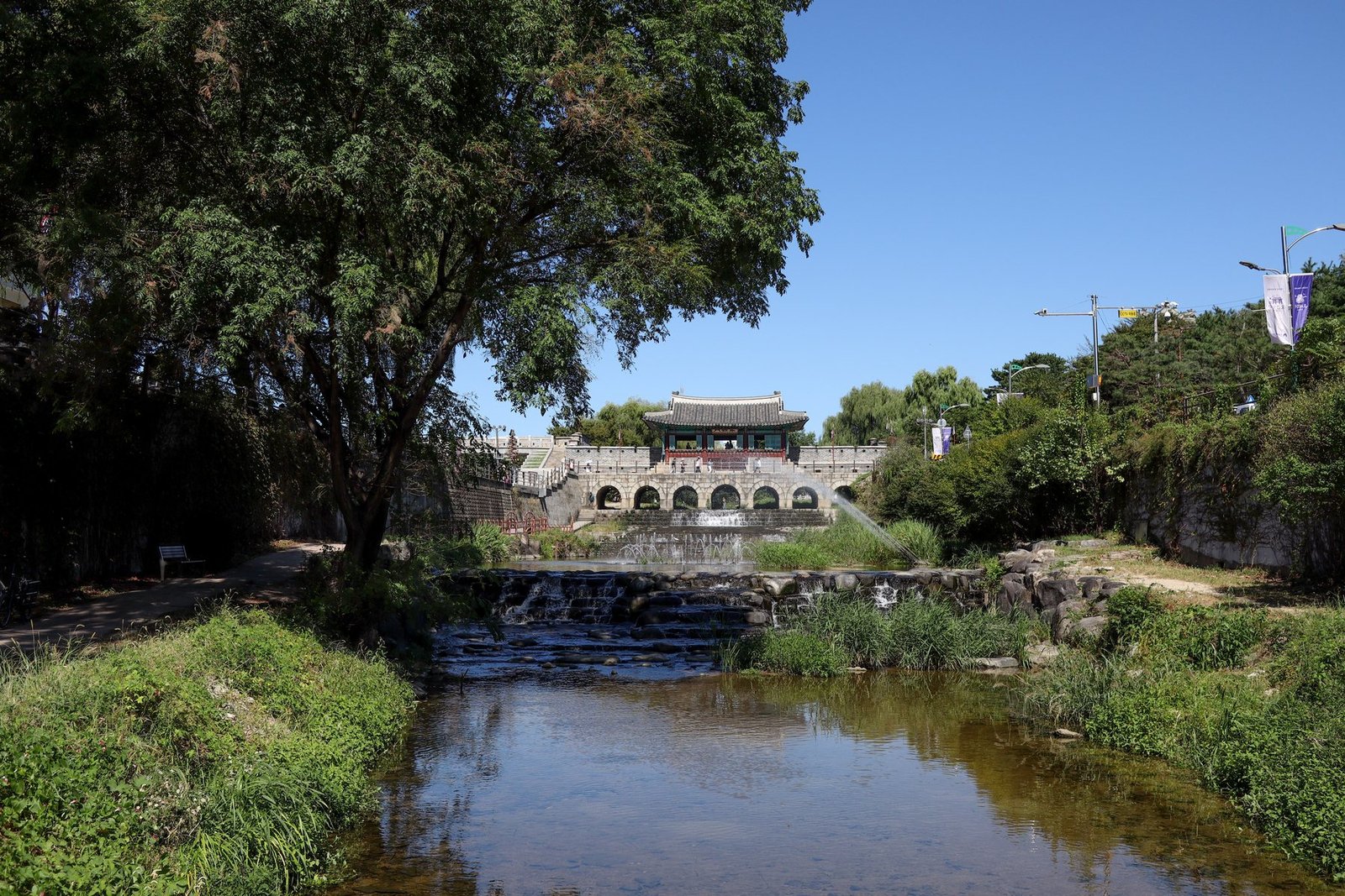 Hwahongmun water gate spans Suwoncheon at Suwon Hwaseong Fortress